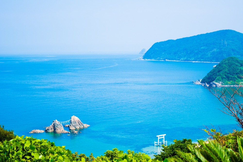 Summer: blue ocean with torii gate and green islands